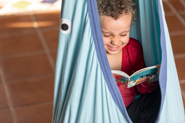 Little boy reading book