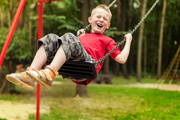 Little boy swinging