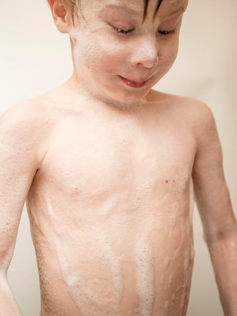 Little boy taking bath