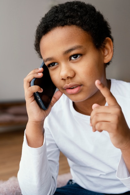 Little boy talking on mobile