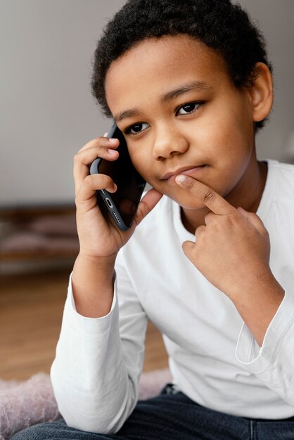 Little boy talking on mobile