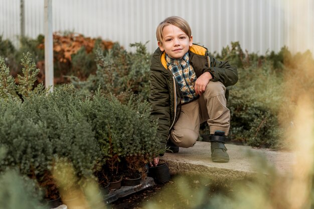 Little boy at a tree nursery