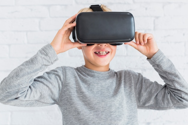 Little boy using virtual reality glasses