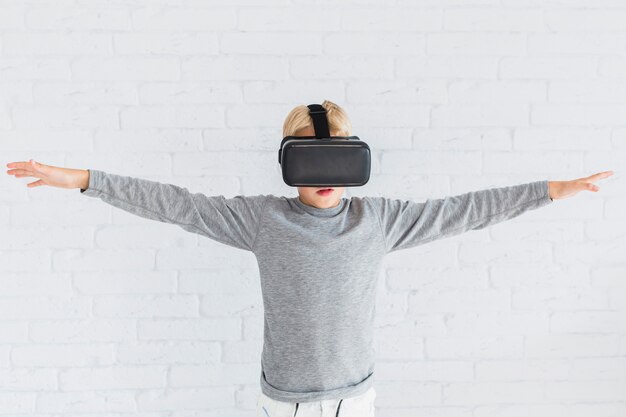 Little boy using virtual reality glasses