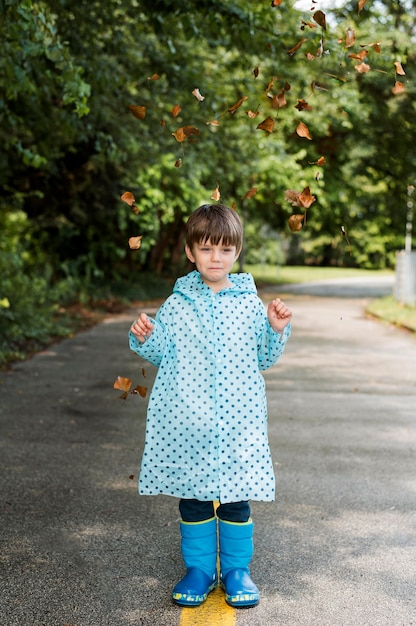 Free photo little boy wearing a rain coat