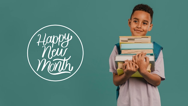 Little boy with happy new month lettering