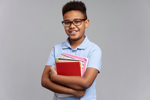 Little boy with notebooks