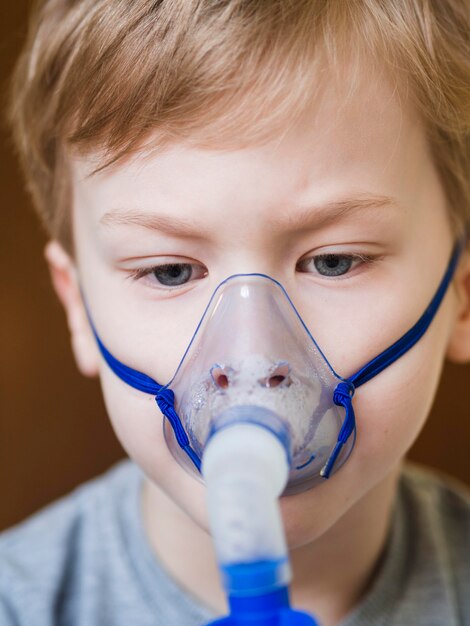 Little boy with oxygen mask