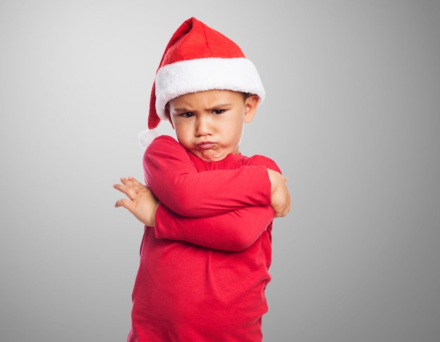 Little boy with problems on gray background