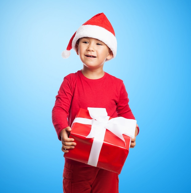 Little boy with a red gift