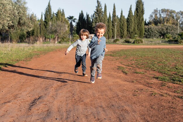 Little boys outdoors running
