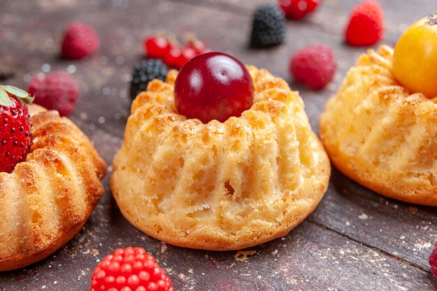 little cakes with fresh fruits on brown, fruit berry bake cake biscuit