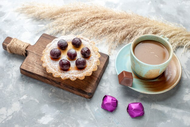 little chery cake with milk coffee on white desk, sweet sugar fruit drink photo