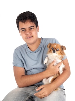 Little chihuahua and teenager in front of white background