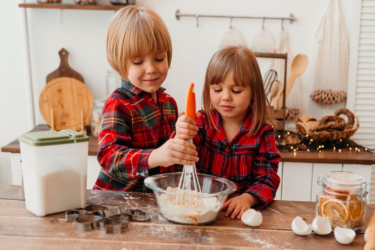 Free Photo little children making christmas cookies