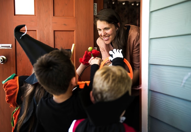 Little children trick or treating on halloween