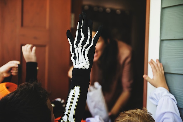 Little children trick or treating on Halloween