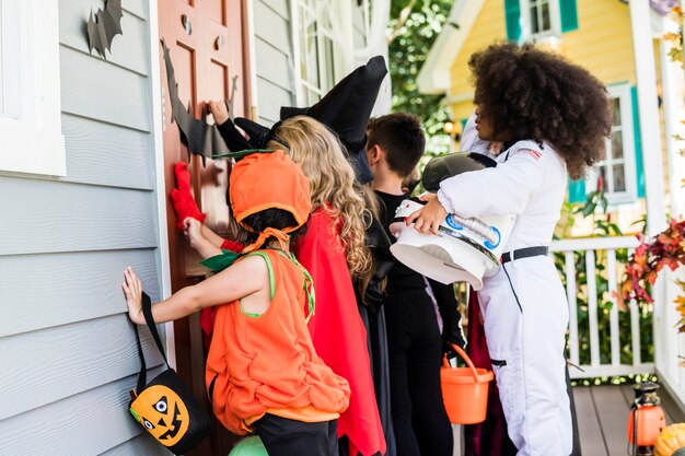 Little children trick or treating on Halloween