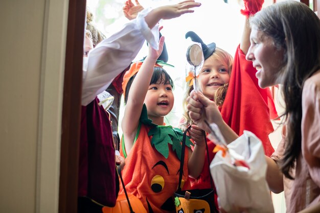 Little children trick or treating on Halloween