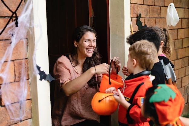 Little children trick or treating on Halloween