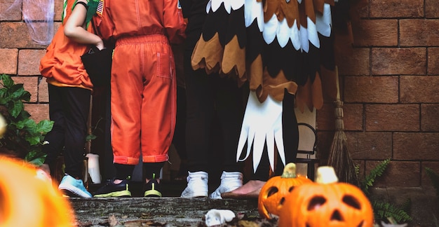 Free photo little children trick or treating on halloween