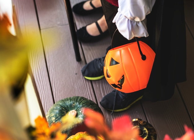 Little children trick or treating on Halloween