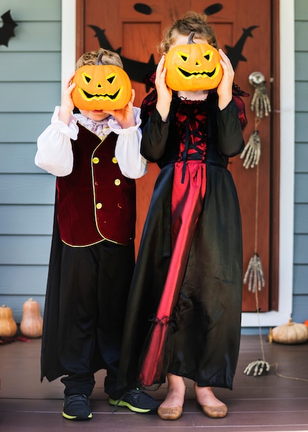 Little children trick or treating on Halloween