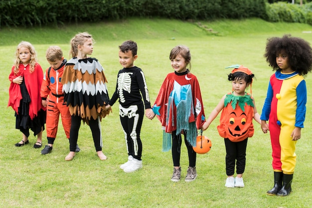 Little children trick or treating on Halloween