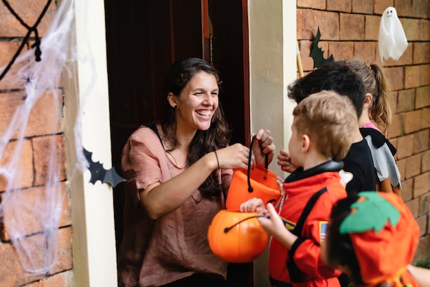 Little children trick or treating on halloween