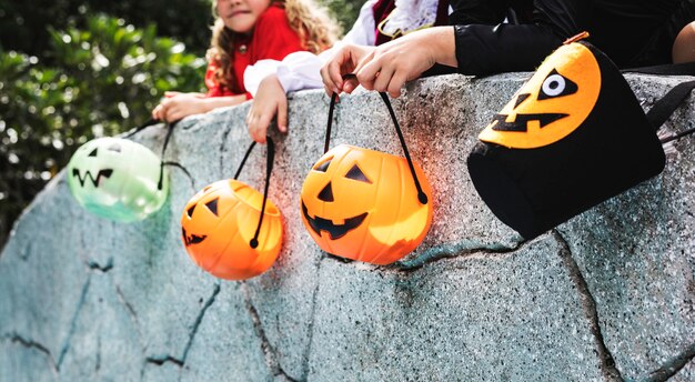 Little children trick or treating on halloween