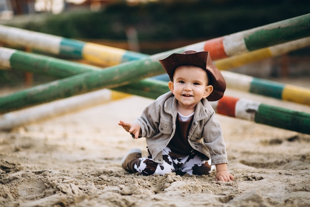 Free photo little cowboy at ranch