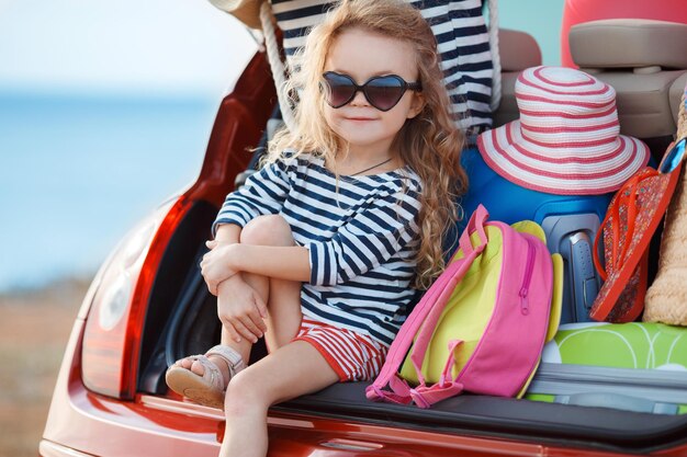 little cute girl going travel by car for vacation