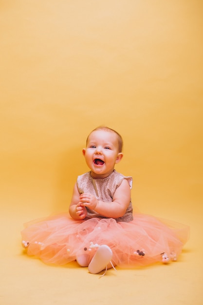 Free photo little cute toddler in dress