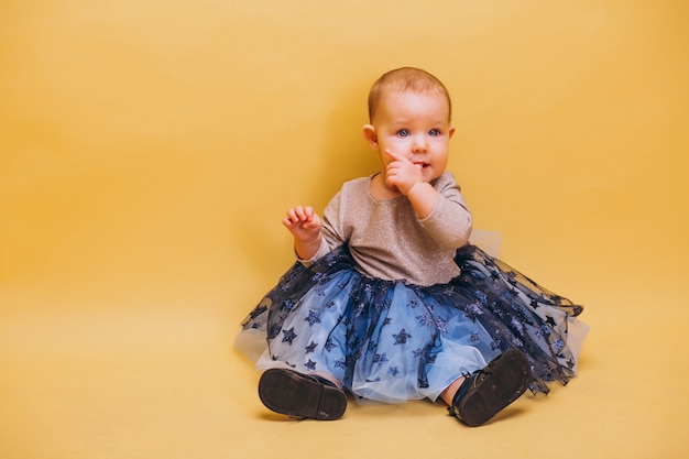 Free photo little cute toddler in dress