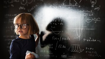 Free photo little genius solving algebra in class