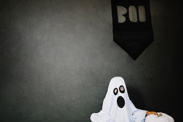 Free Photo little ghost and pumpking