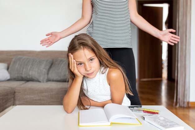 Little girl being annoyed at her homework