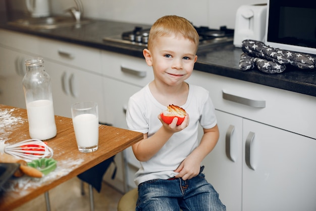 Little girl cook the dough for cookies