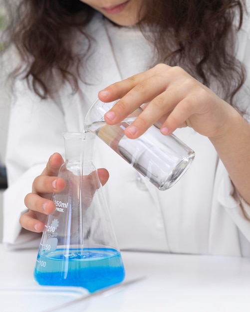 Little girl doing a science experiment at school