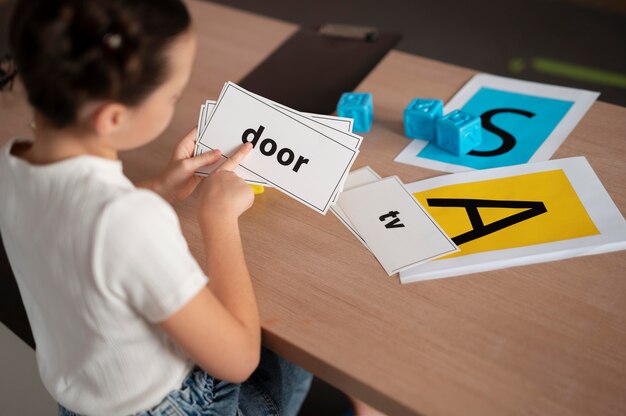 Little girl doing speech therapy at a clinic