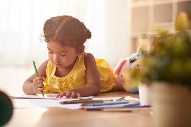 Little Girl Focused on Drawing