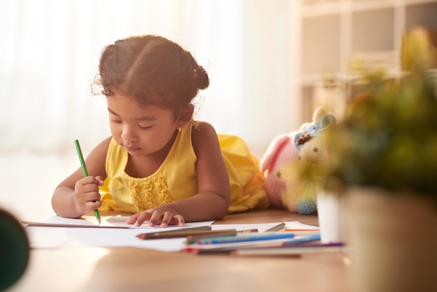 Little Girl Focused on Drawing