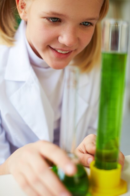 Little girl having fun in chemistry class