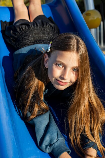 Little girl having fun on a slide