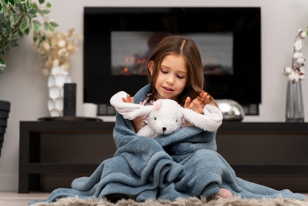 Little girl having fun with her toy