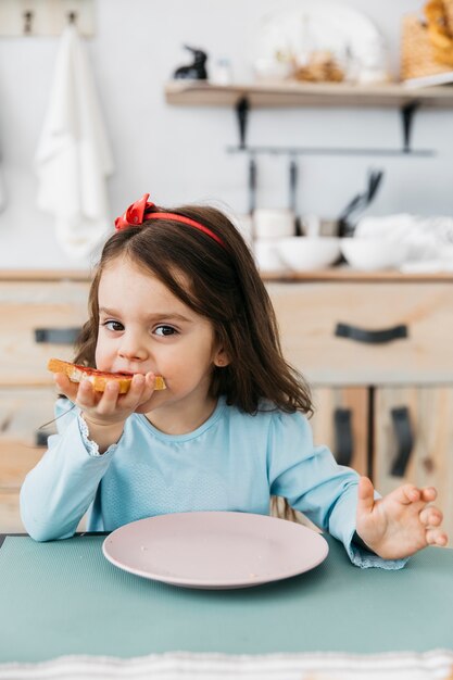 Little girl having her breakfast