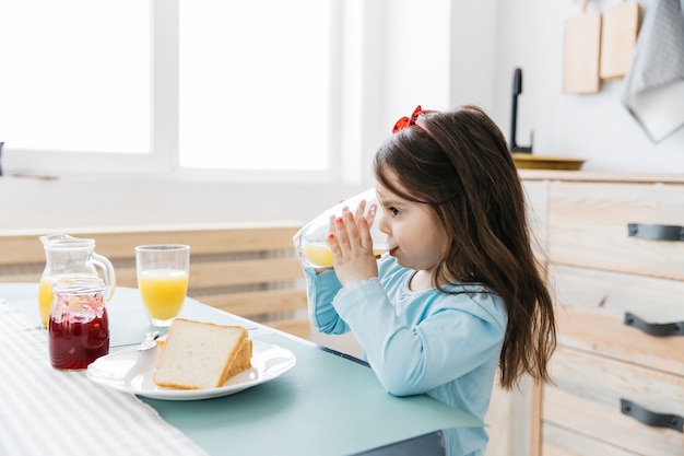 Little girl having her breakfast