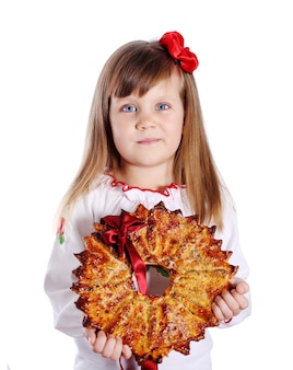 큰 크리스마스 스타, 전통적인 디저트를 들고 어린 소녀. 우크라이나 칼리타