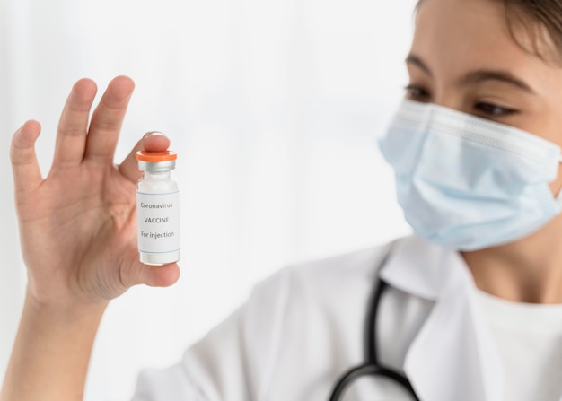 Little girl holding a coronavirus recipient