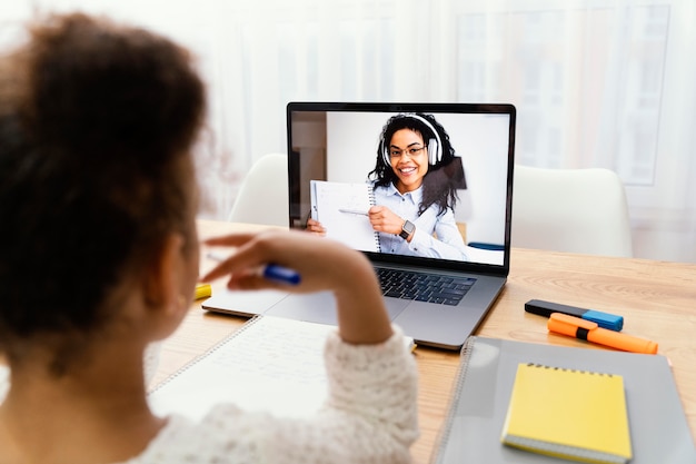 Little girl at home during online school